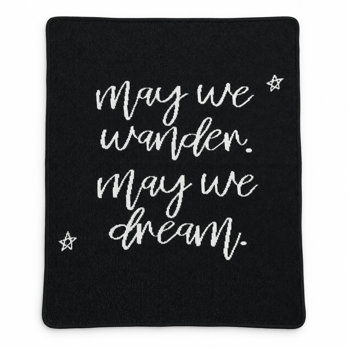 Black May We Wander May We Dream blanket with script lettering and stars, shown fully extended on a white background.