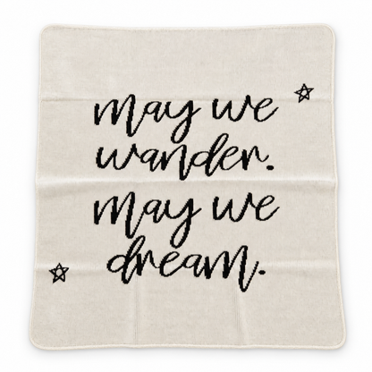Natural May We Wander May We Dream blanket with script lettering and stars, shown fully extended on a white background.