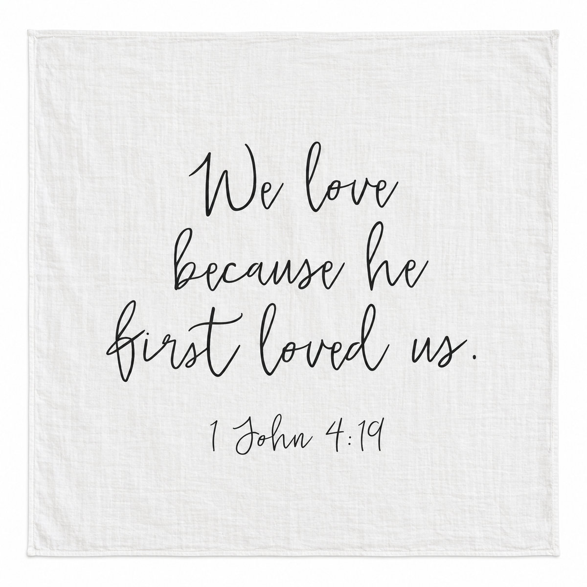1 John 4:19 Scripture Swaddle + Wall Art shown fully open and flat on a white background.