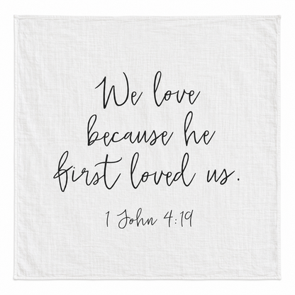 1 John 4:19 Scripture Swaddle + Wall Art shown fully open and flat on a white background.