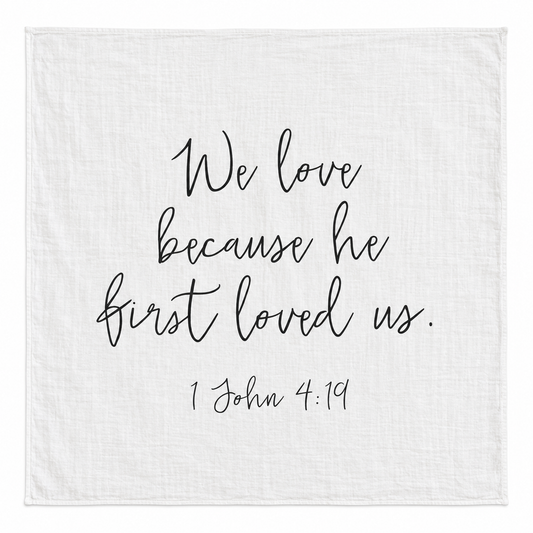 1 John 4:19 Scripture Swaddle + Wall Art shown fully open and flat on a white background.