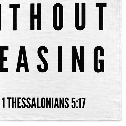 1 Thessalonians 5:17 Scripture swaddle detail showing the printed lettering and hem.
