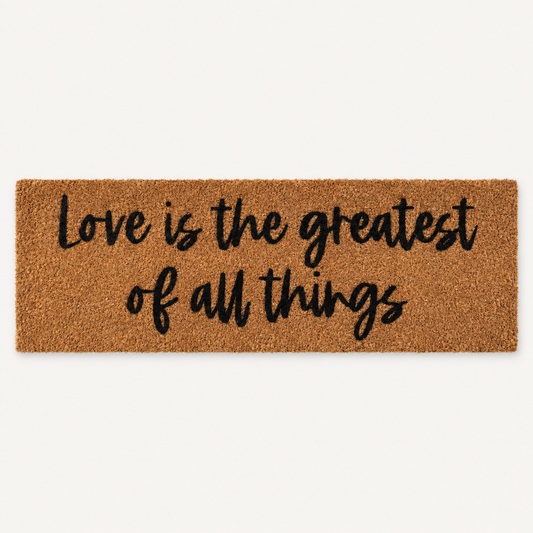 Love Is the Greatest of All Things | XL Doormat shown alone on a warm off-white studio background.