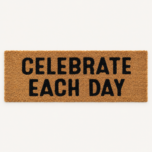Celebrate Each Day | XL Doormat shown alone on a warm off-white studio background.