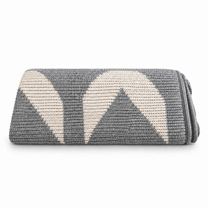 XO Recycled Cotton Throw Blanket | Allover Pattern — XO recycled cotton throw in Aluminum, folded view showing the color and knit pattern.