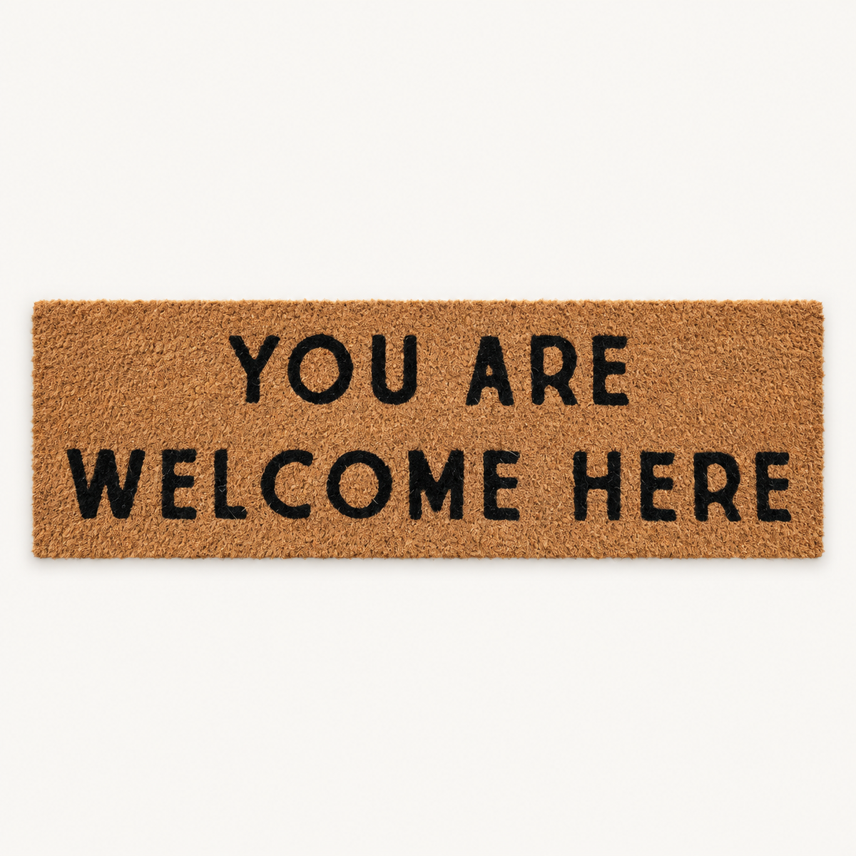 You Are Welcome Here | XL Doormat shown alone on a warm off-white studio background.