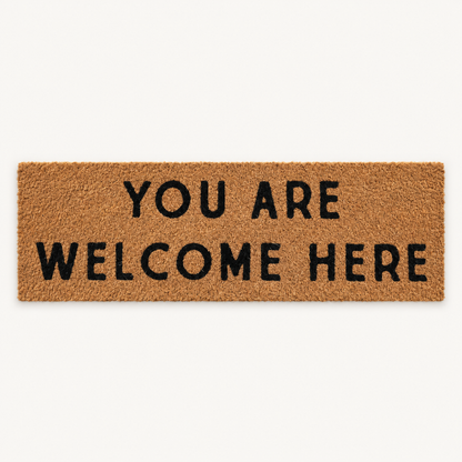 You Are Welcome Here | XL Doormat shown alone on a warm off-white studio background.