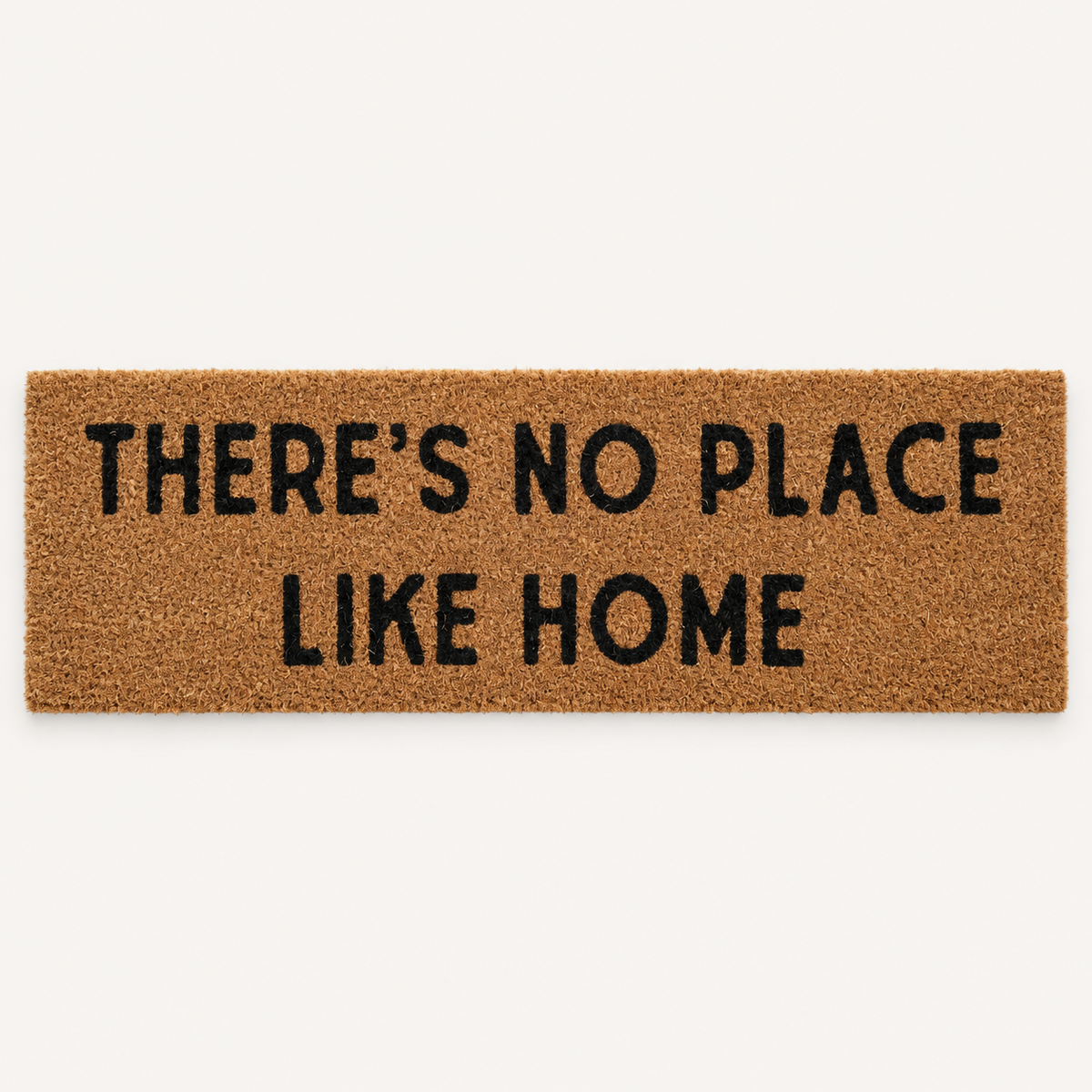 There's No Place Like Home | XL Doormat shown alone on a warm off-white studio background.