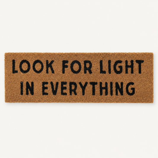 Look for Light in Everything | XL Doormat shown alone on a warm off-white studio background.