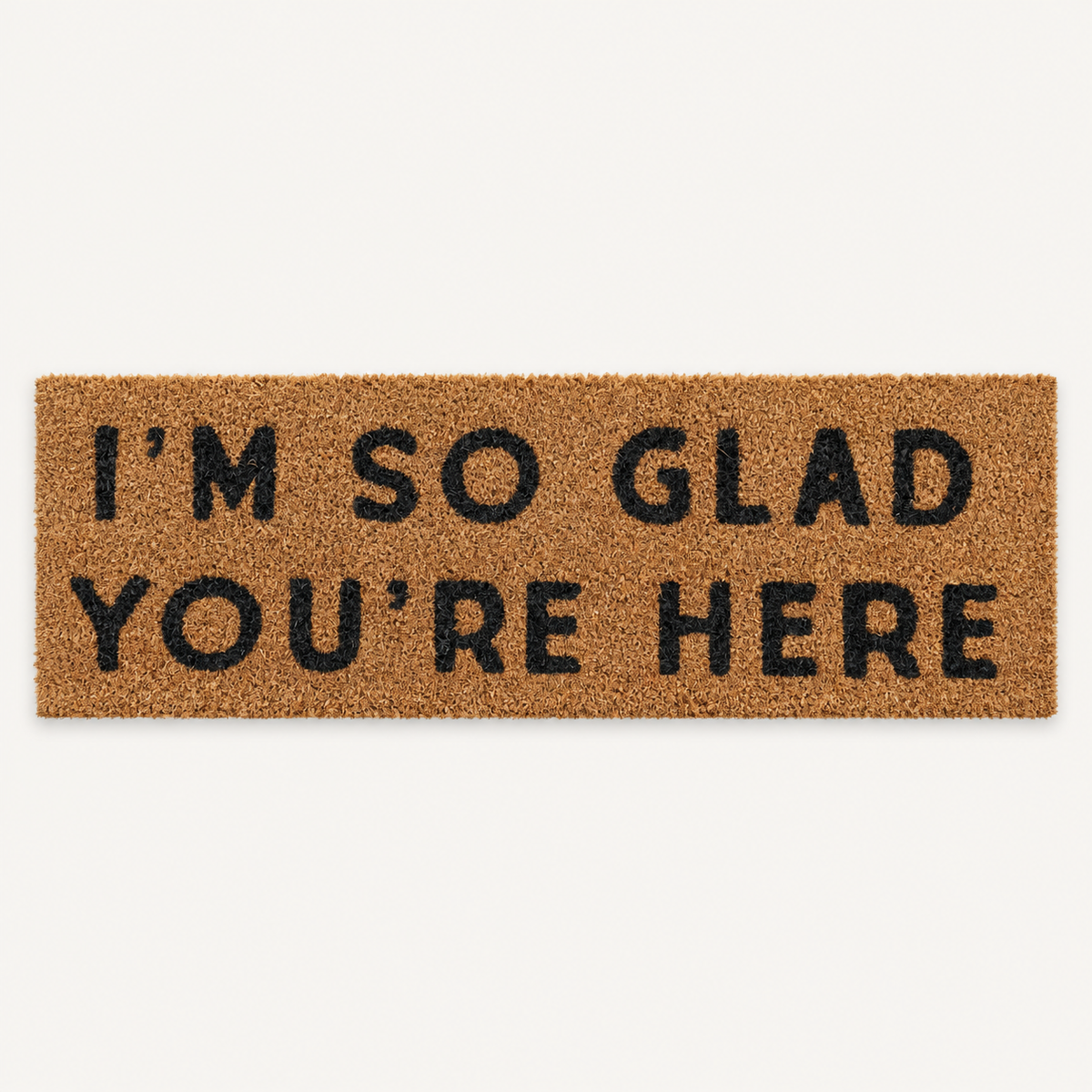 I'm So Glad You're Here | XL Doormat shown alone on a warm off-white studio background.