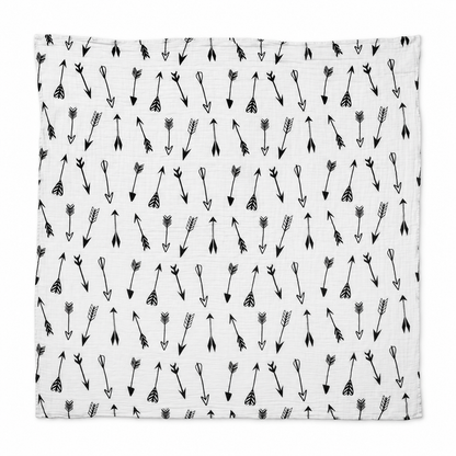 Arrows organic cotton muslin swaddle laid fully open on white, showing the square shape, original black arrow print and stitched edges.