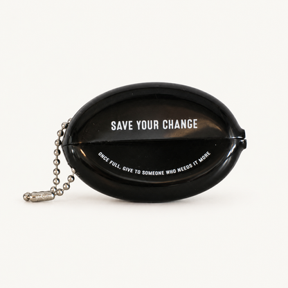 Back of black coin pouch: Save Your Change; Once Full, Give to Someone Who Needs It More
