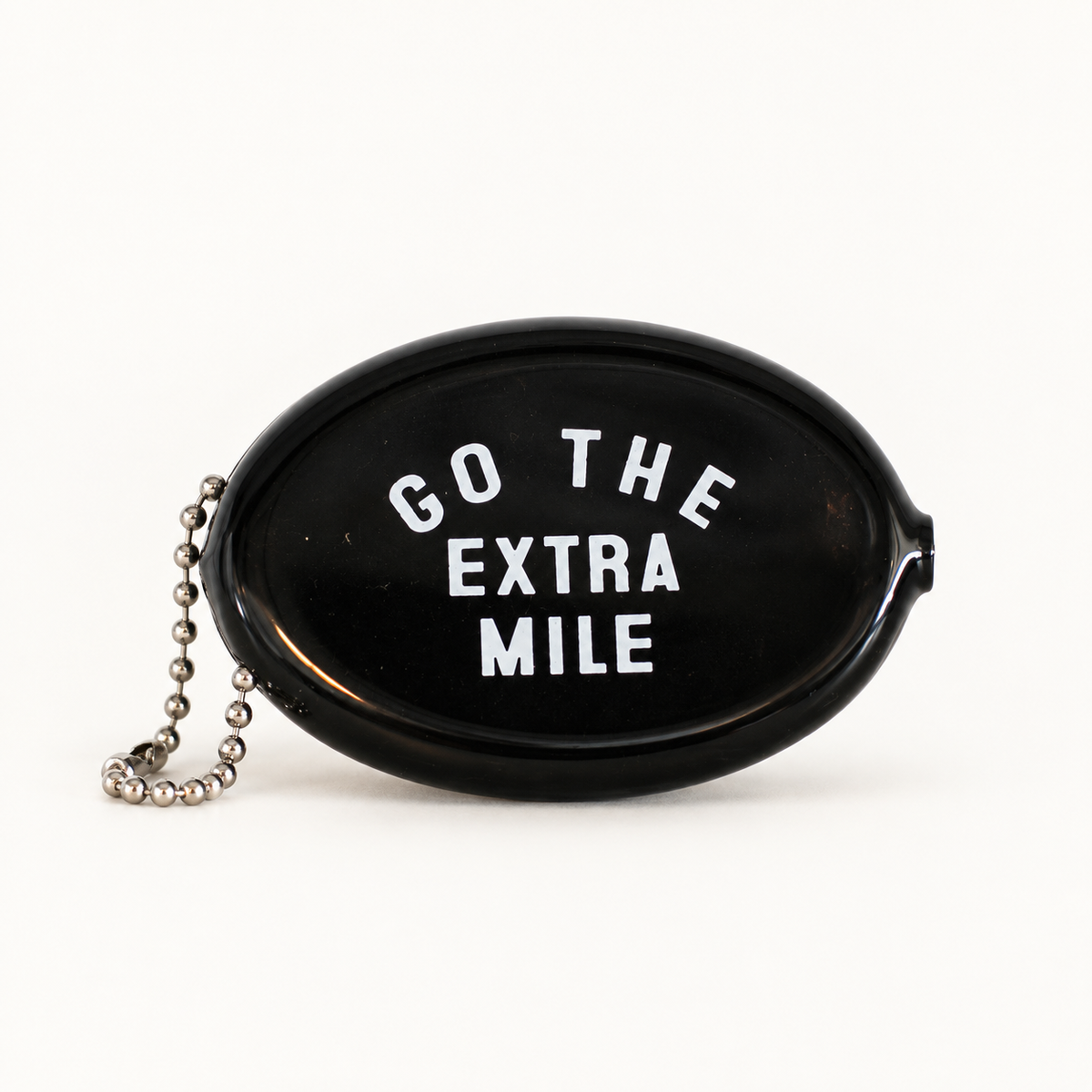 Black coin pouch with Go the Extra Mile message, front view