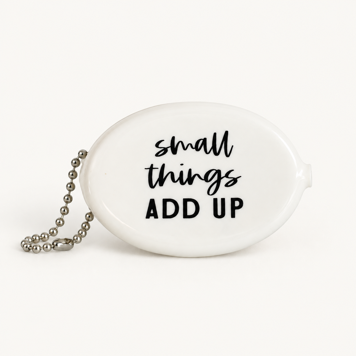 White coin pouch with Small Things Add Up message, front view