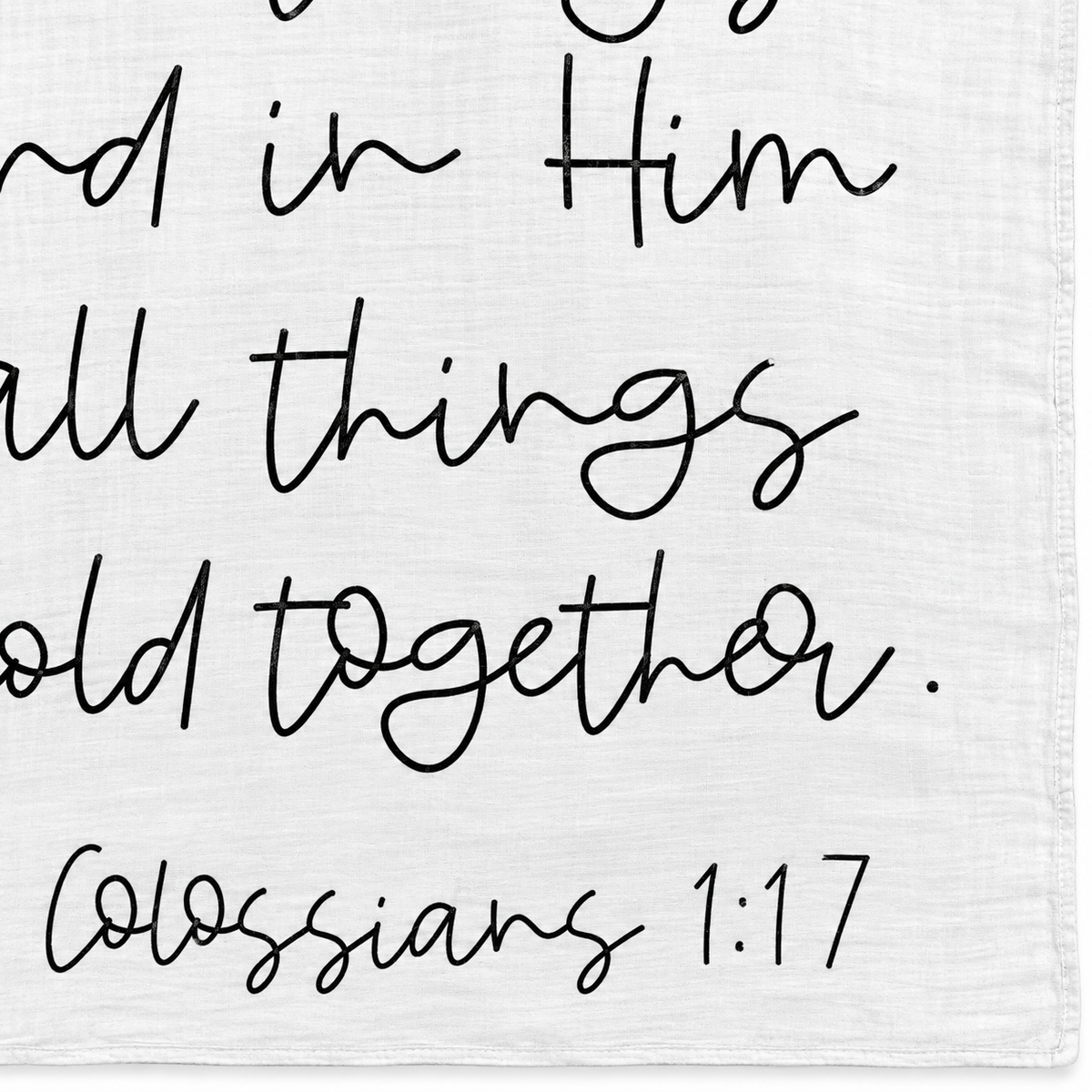 Colossians 1:17 Scripture swaddle detail showing the printed lettering and hem.