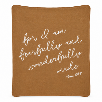 Full view of the Fearfully and Wonderfully Made knit blanket in Caramel with cream Psalm 139:14 lettering