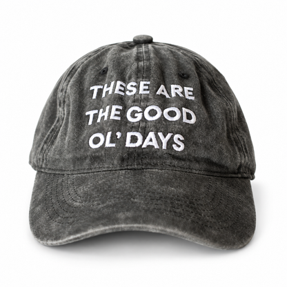 Washed black These Are the Good Ol’ Days cap with white embroidery, front view.