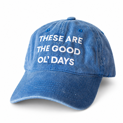 Washed blue These Are the Good Ol’ Days cap with white embroidery, front three-quarter view.