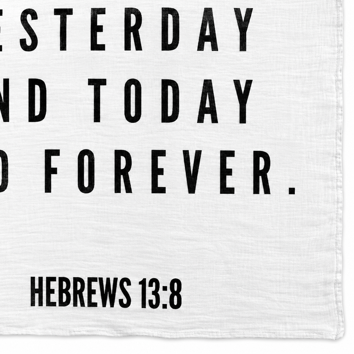 Hebrews 13:8 Scripture swaddle detail showing the printed lettering and hem.