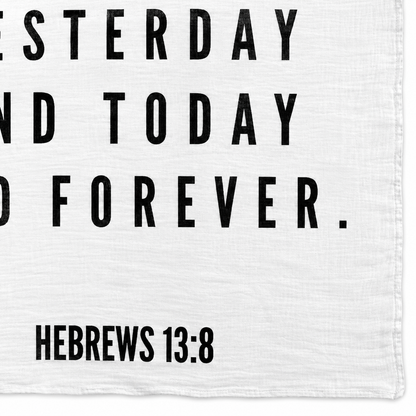 Hebrews 13:8 Scripture swaddle detail showing the printed lettering and hem.