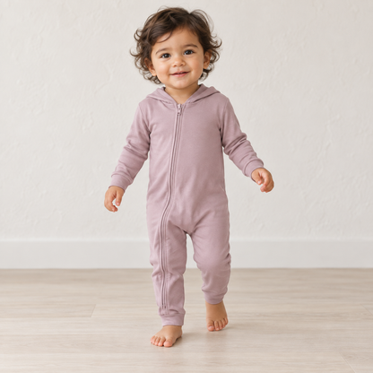 Child wearing the Modern Burlap organic hoodie zip coverall in Mauve