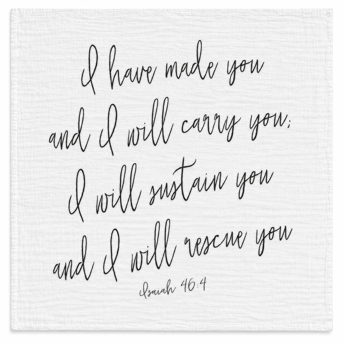 Isaiah 46:4 organic cotton muslin swaddle, full handwritten black design on white fabric, studio view.