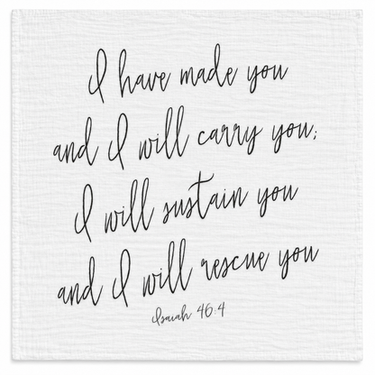 Isaiah 46:4 organic cotton muslin swaddle, full handwritten black design on white fabric, studio view.