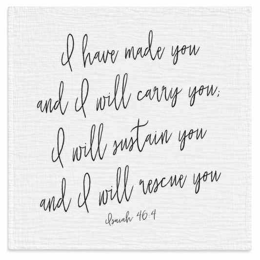 Isaiah 46:4 organic cotton muslin swaddle, full handwritten black design on white fabric, studio view.