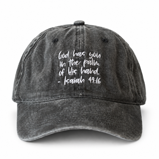 Washed black adult cap with God has you in the palm of His hand, Isaiah 49:16 embroidery.