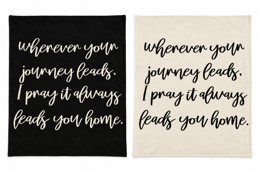 Wherever Your Journey knit blankets in Black and Natural, shown together on white.