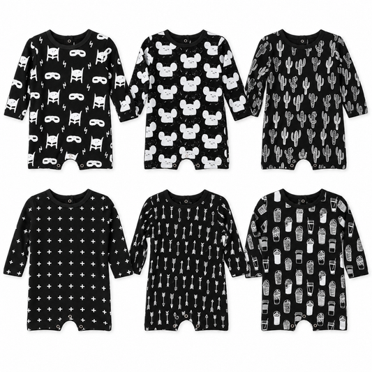 All six signature prints of the organic long sleeve romper, shown at consistent scale in an AI-assisted studio flat lay. Each romper sold separately.