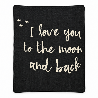 Full view of the black I Love You to the Moon and Back knit blanket with cream lettering and three stars