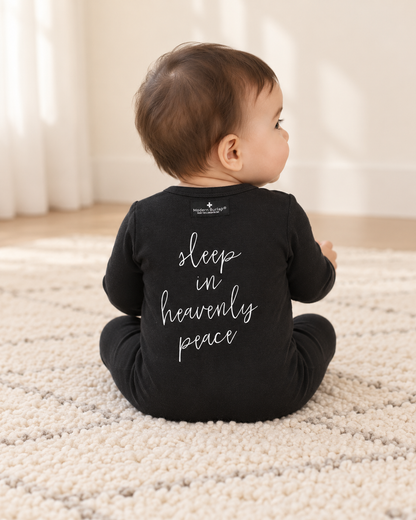 Baby showing the back design of Sleep in Heavenly Peace Button Footie; AI-styled product image.