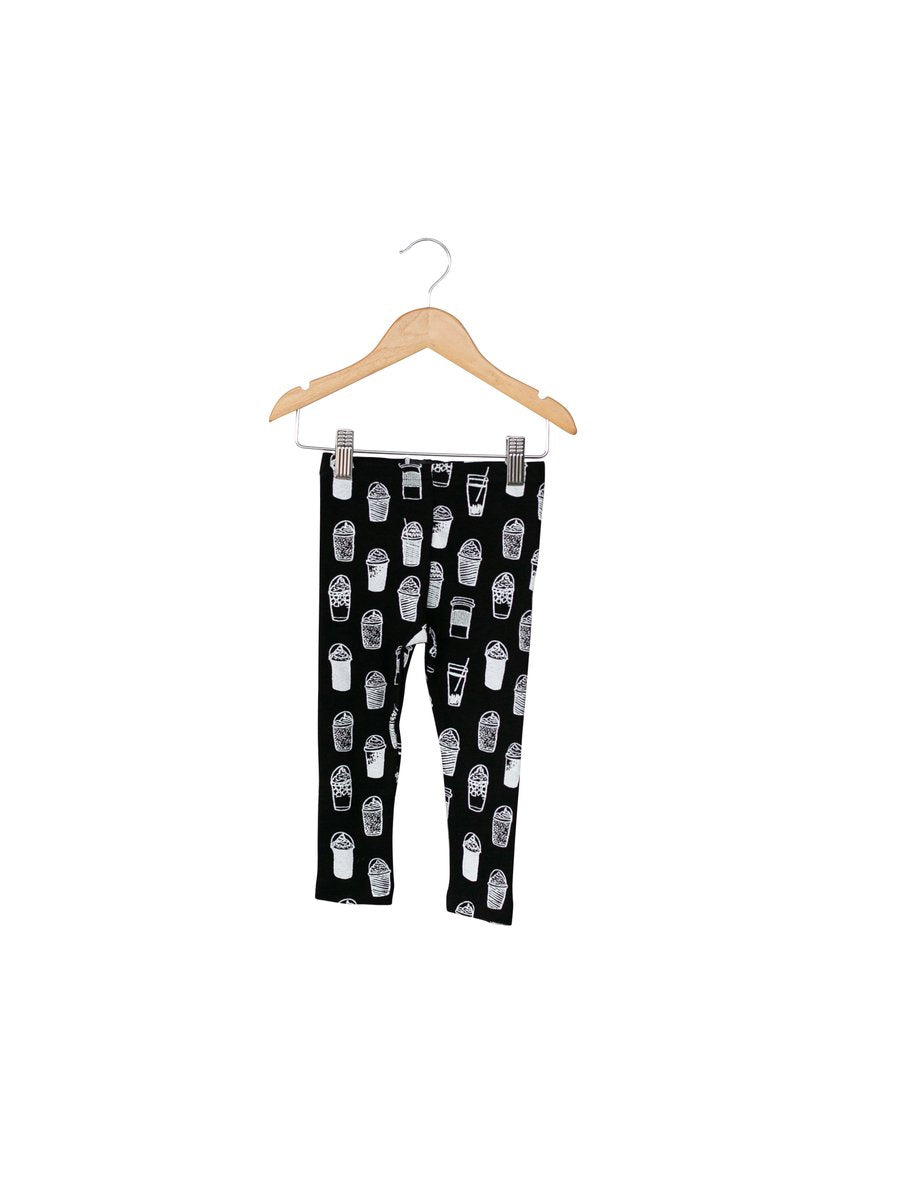 Child wearing Modern Burlap organic leggings in a signature black and white print