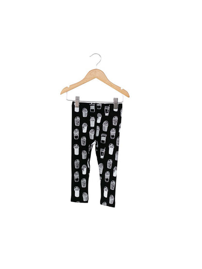 Child wearing Modern Burlap organic leggings in a signature black and white print
