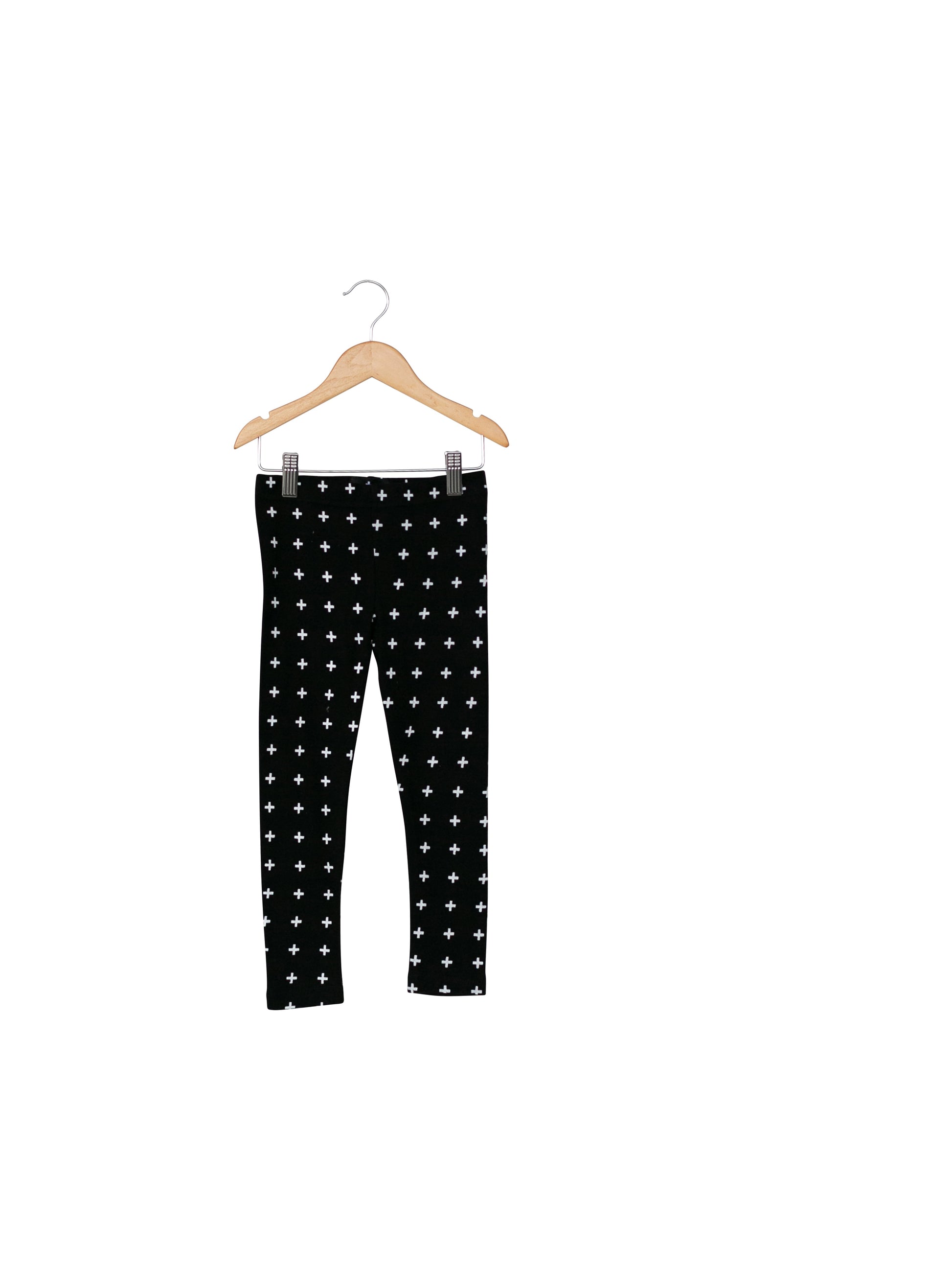 Child styled in Modern Burlap organic cotton leggings in a signature monochrome print
