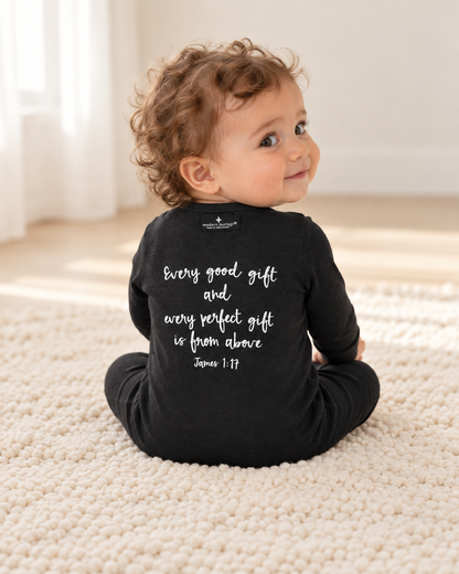 Baby showing the back design of James 1:17 Organic Zip Footie; AI-styled product image.