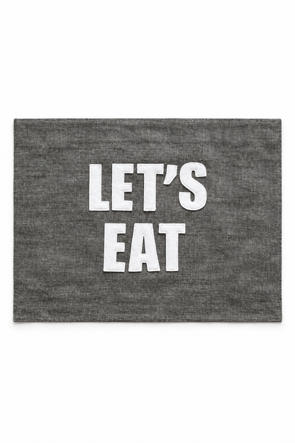 Graphite linen placemat with ivory Let's Eat lettering. One placemat.