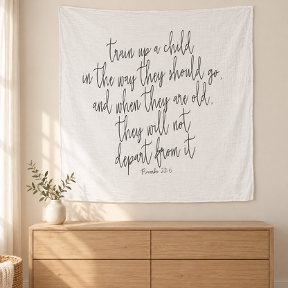Styled wall-display mockup of the Proverbs 22:6 Scripture swaddle above an oak dresser; decor not included.