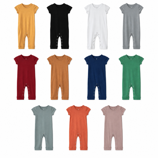 Eleven solid short sleeve Explorer Back jumpsuit colors at matching scale: Honey, Black, White, Neutral Gray, Maroon, Ginger, Navy Peony, Pine Green, Tradewinds, Aragon and Mauve.