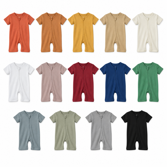 All 14 short sleeve zip romper colors arranged at matching scale on white: Aragon, Ginger, Honey, Hazelnut, Eggnog, White, Mauve, Maroon, Navy Peony, Pine Green, Tradewinds, Silver, Neutral Gray and Black.