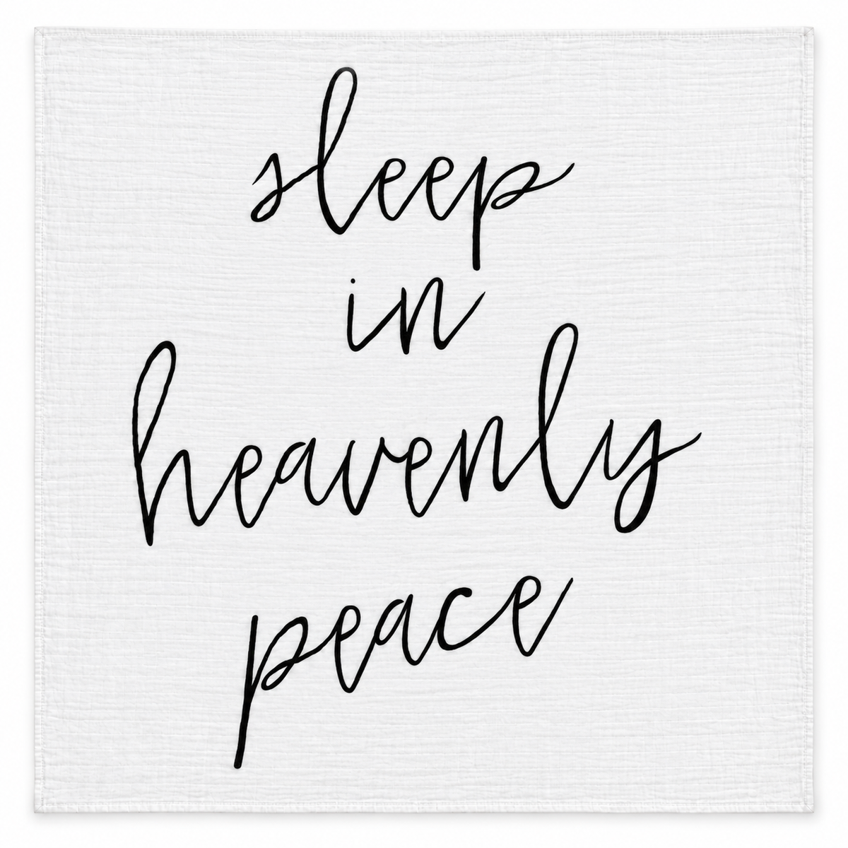Sleep in Heavenly Peace organic muslin swaddle laid flat, showing the full black handwritten design on white fabric.