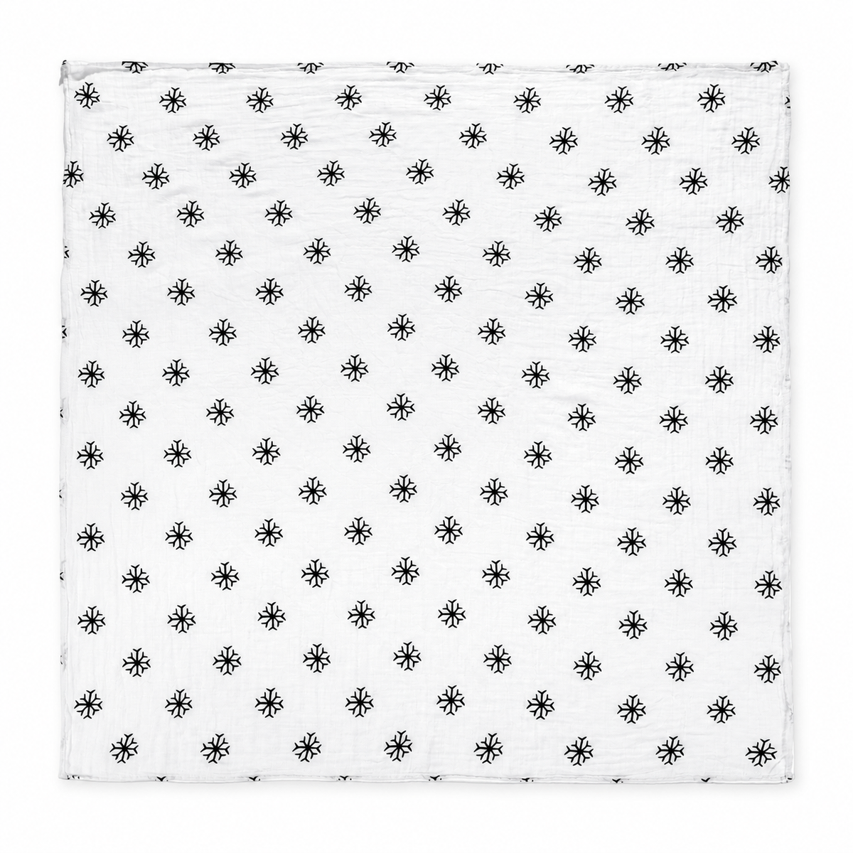Snowflakes organic cotton muslin swaddle laid fully open, showing the square shape, black snowflake print and stitched edges on a white studio background.