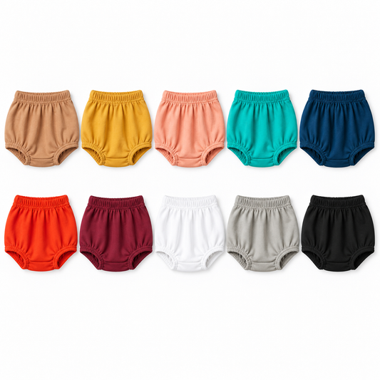 Ten Modern Burlap organic baby bloomer colors arranged on white