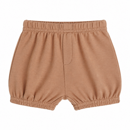 Modern Burlap organic baby and toddler shorts in Ginger, front studio view with faux fly and gathered hems on white