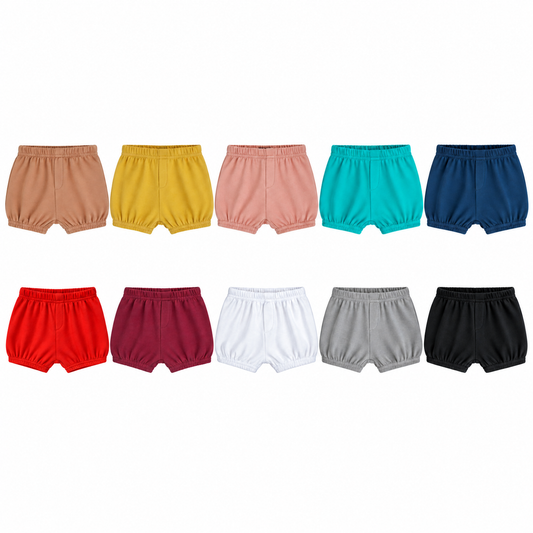 All ten Modern Burlap solid shorts colors, equally sized front flat lays with faux fly and gathered hems