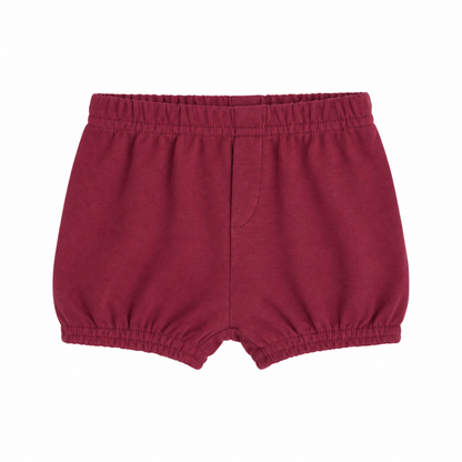 Modern Burlap organic baby and toddler shorts in Maroon, front studio view with faux fly and gathered hems on white