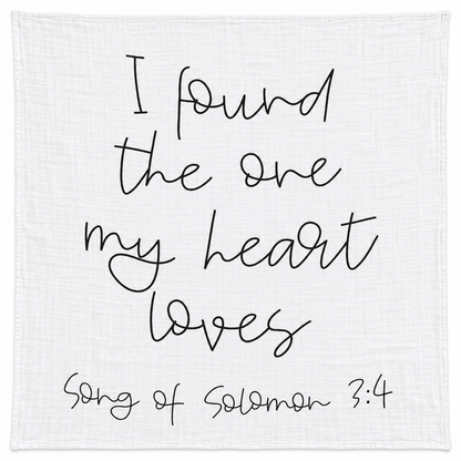 Song of Solomon 3:4 organic cotton muslin swaddle, full black handwritten design on white fabric.