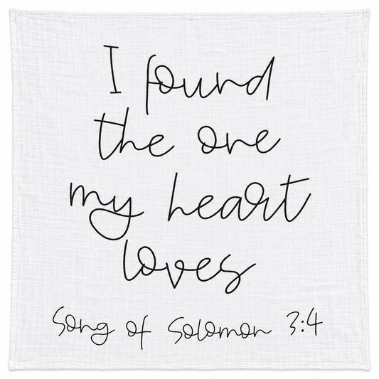 Song of Solomon 3:4 organic cotton muslin swaddle, full black handwritten design on white fabric.