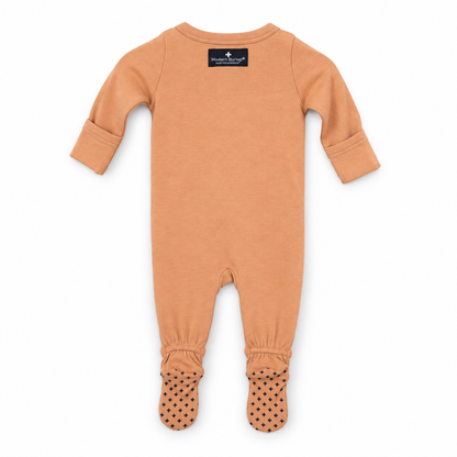 Organic baby two-way zip footie in Dusty Coral, back studio view with fold-over cuffs and cross foot grips